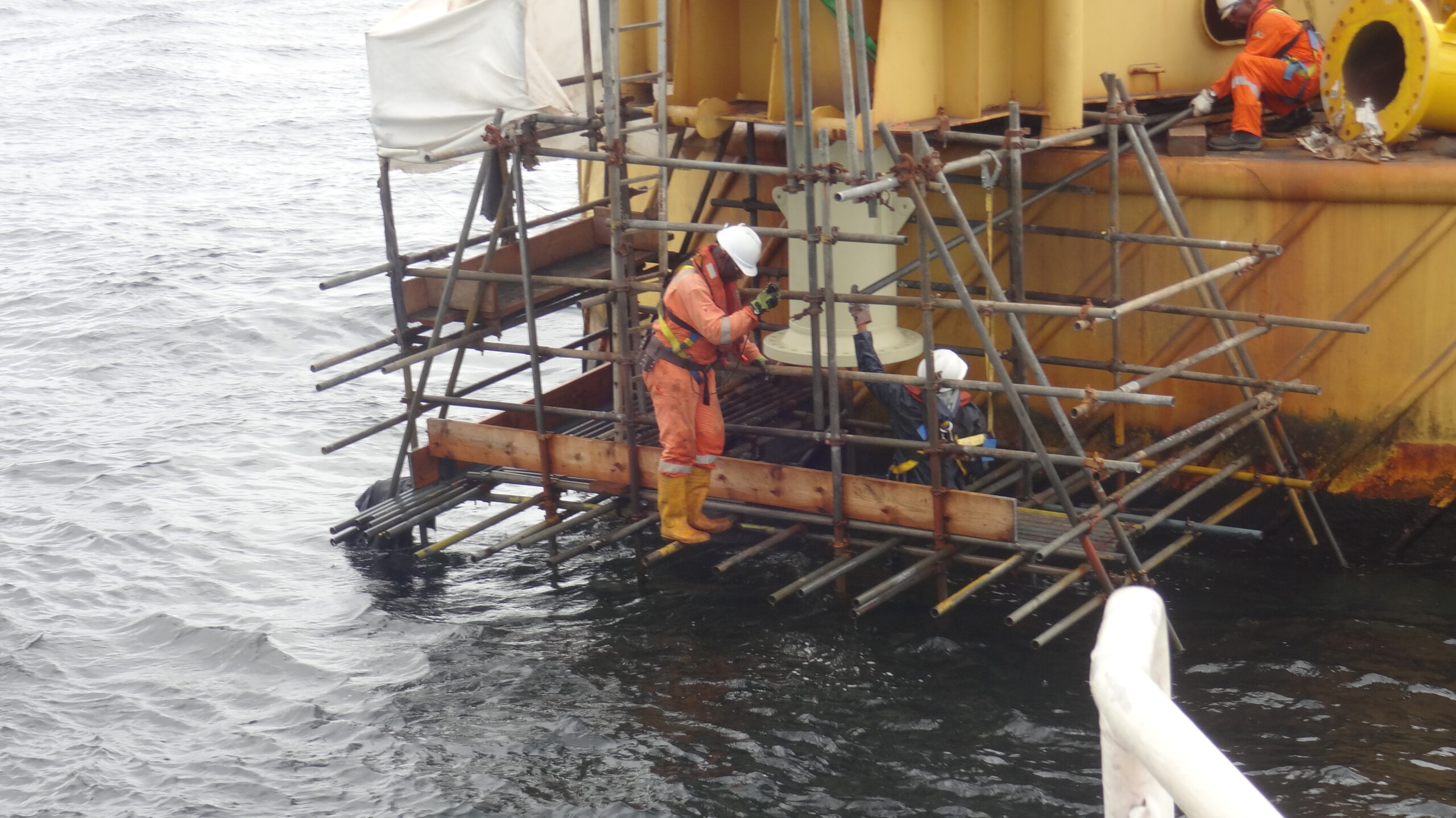NNPC profit fall - engineers at work on an offshore installation in Nigeria
