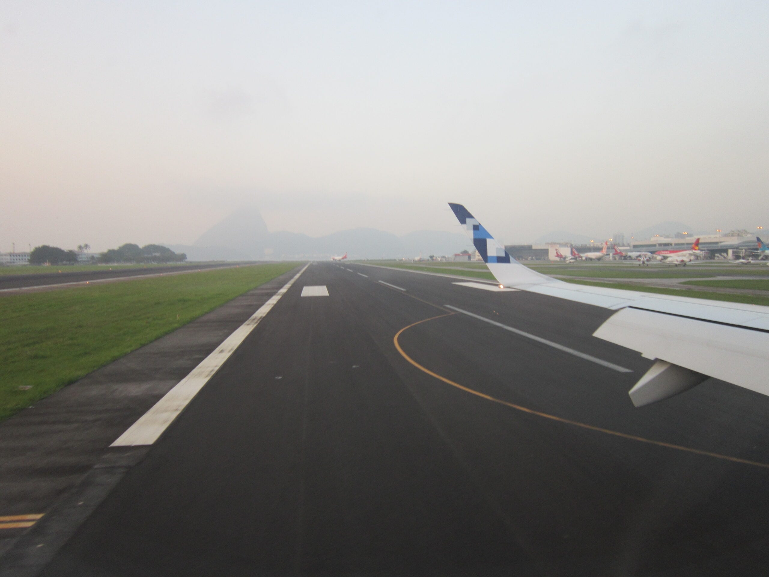 The runway at Santos Dumont airport in Rio de Janeiro, with the grass strip beside it