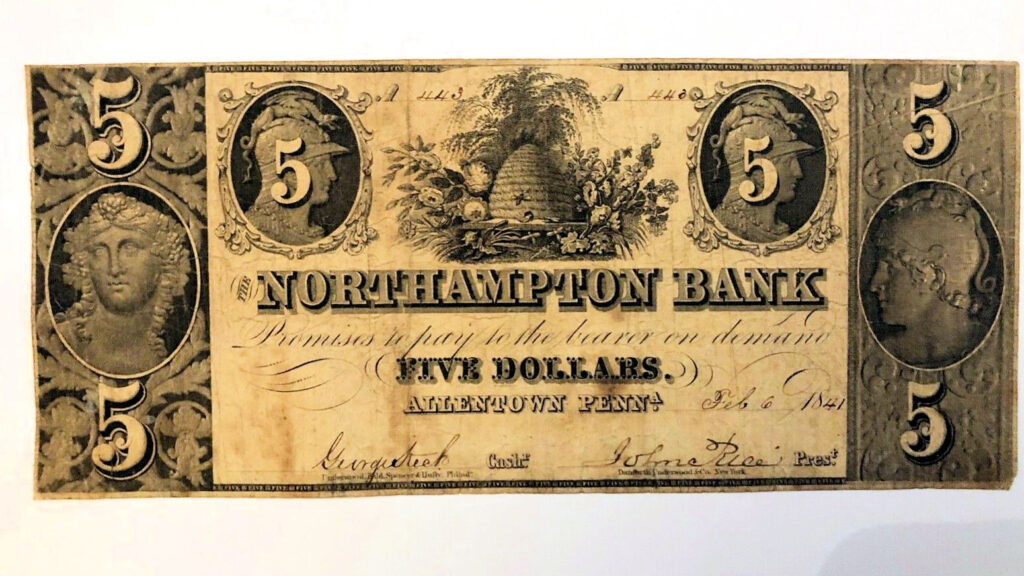 A spread of US dollar banknotes in several denominations