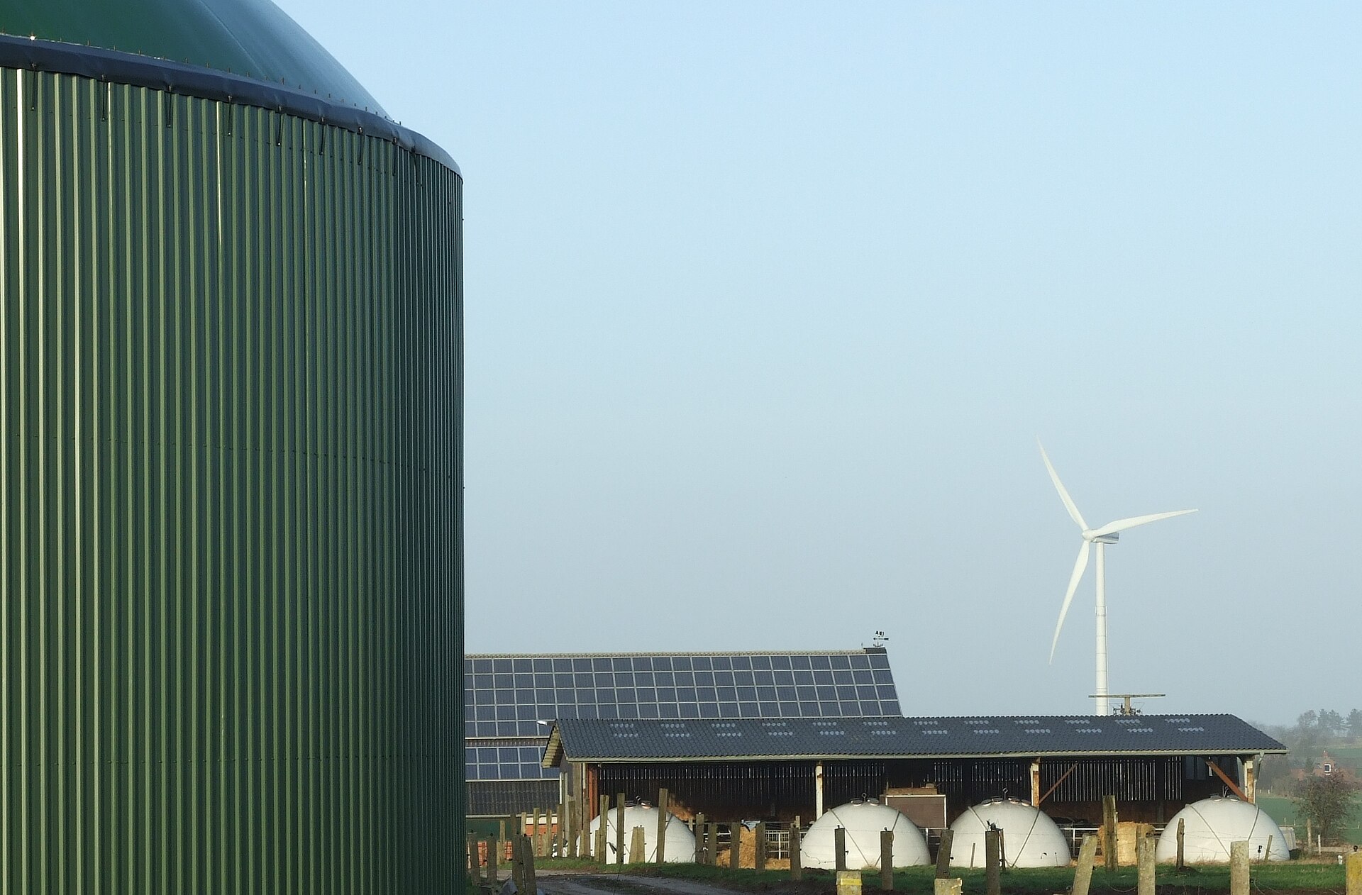 Uruguay green hydrogen project site in Paysandú with wind turbines and industrial plants