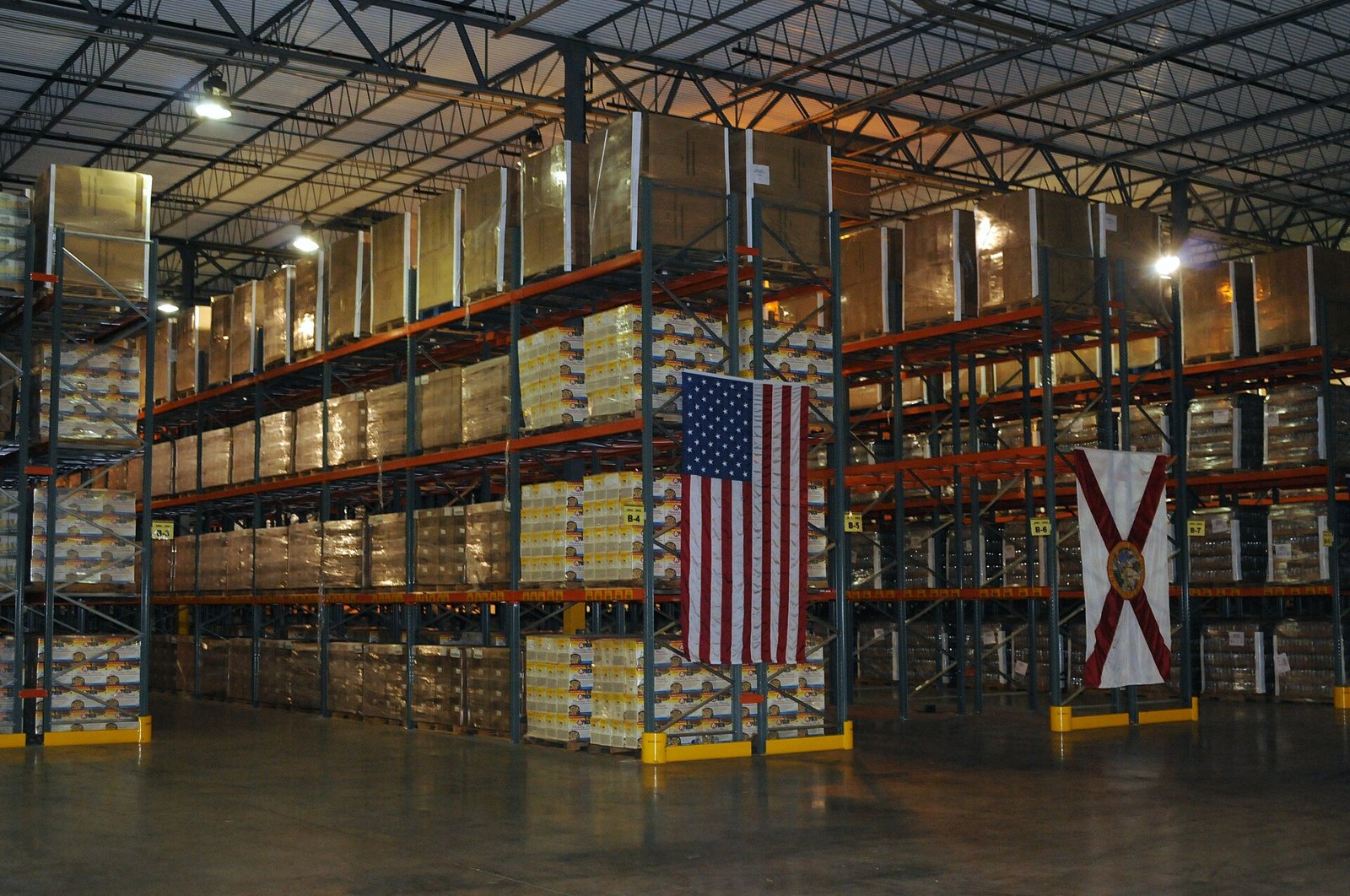 American wholesale warehouse, illustrating the USA and Canada Intelligence Brief for August 13, 2026