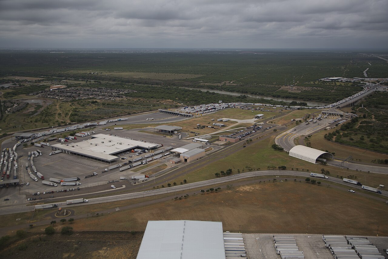 Cargo trucks lined up at a Mexico-US border crossing amid new tariff threats
