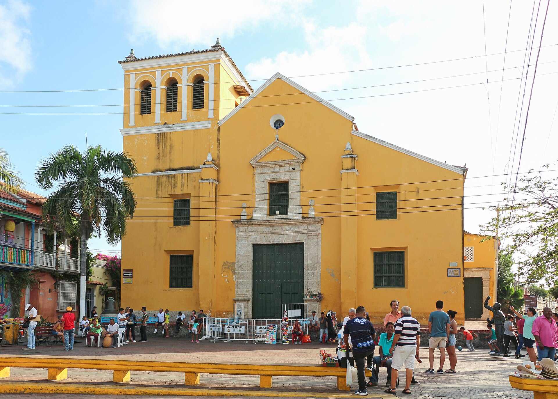 The yellow Church of the Holy Trinity on a square in Cartagena, Colombia