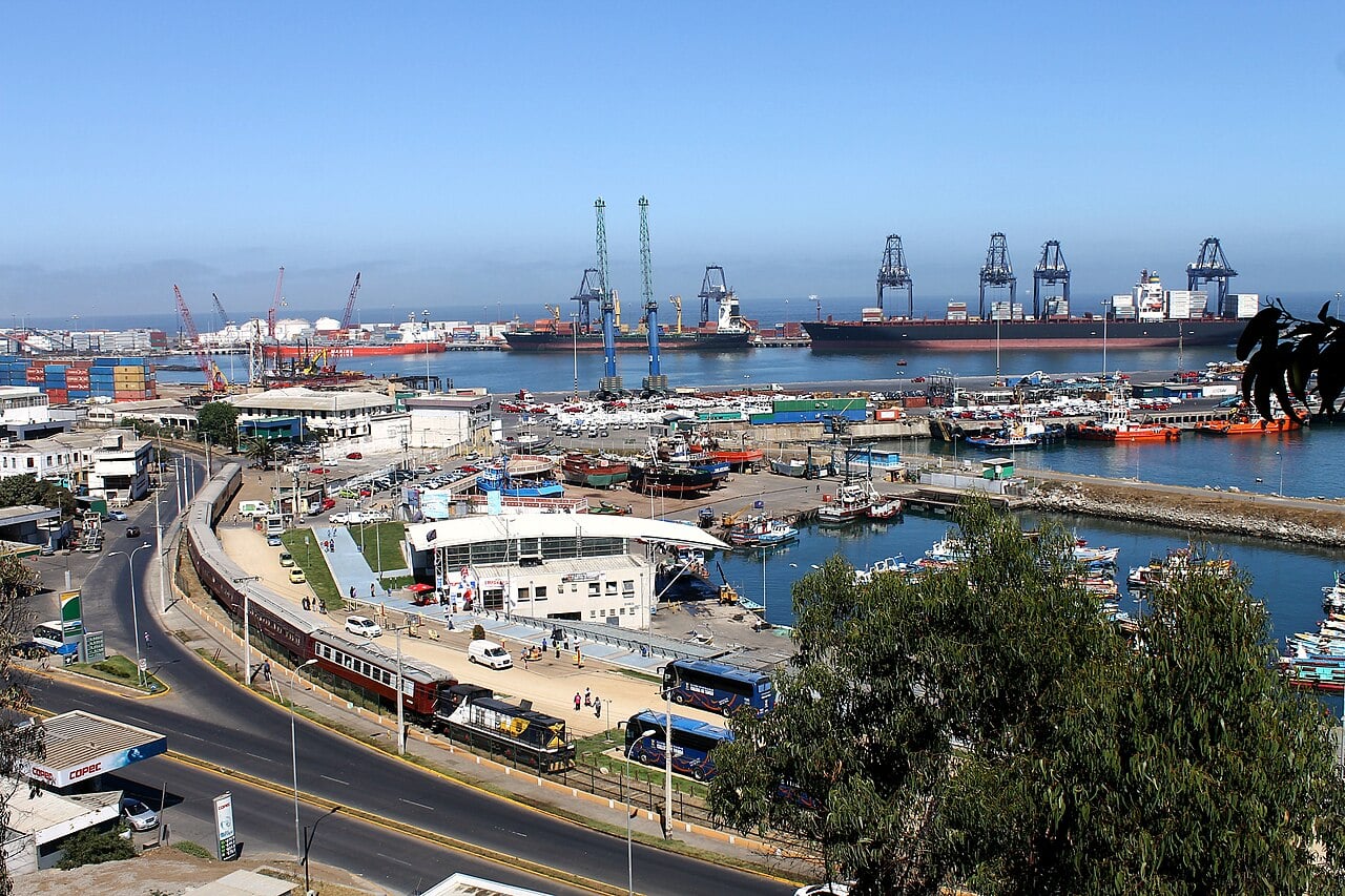 A car carrier ship unloads new vehicles at Chile's Port of San Antonio