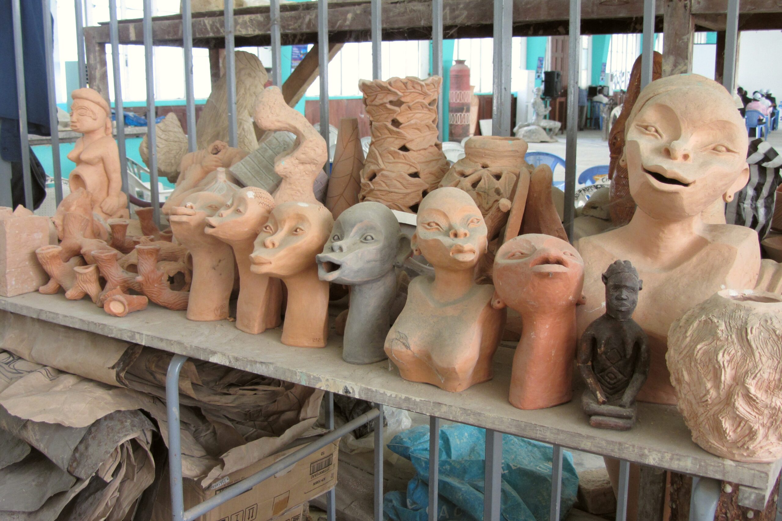 Sculptures on a shelf at an art school in Kinshasa