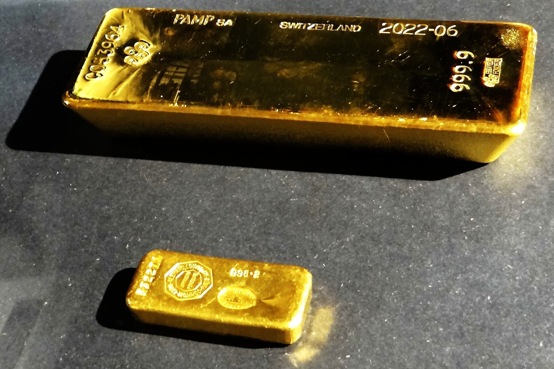 Gold ingot and bar on display