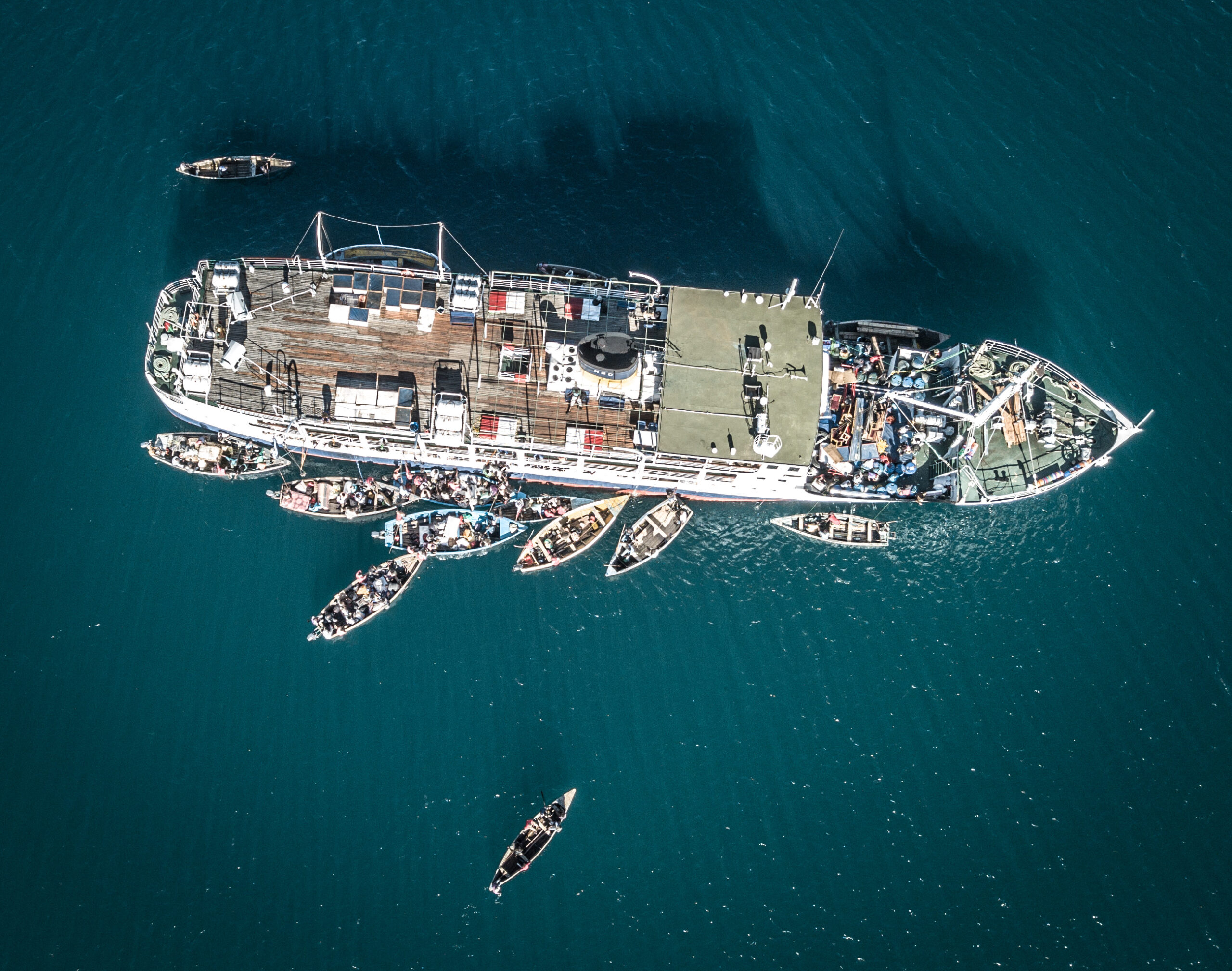Malawi lake transport — the MV Ilala loading passengers and cargo from small boats on Lake Malawi