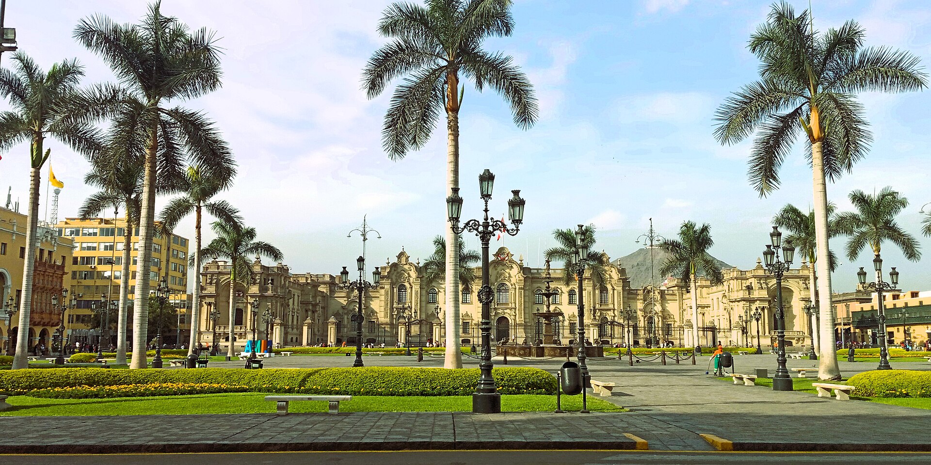 The Plaza Mayor in central Lima with palm trees and the Government Palace behind