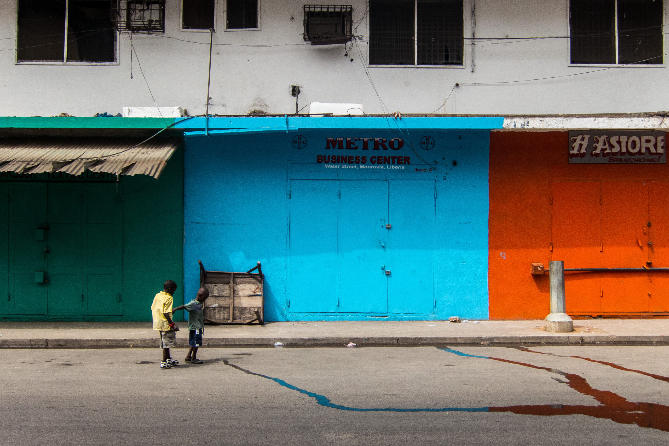 Liberia fiscal space — shopfronts on Water Street in central Monrovia