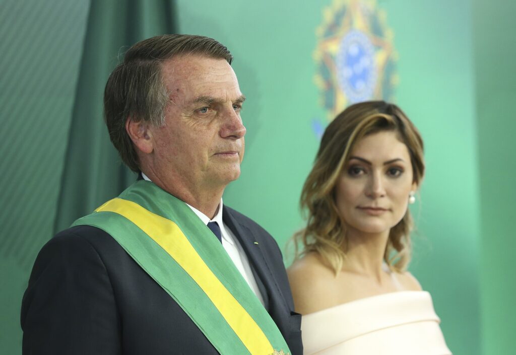 Jair Bolsonaro and woman in formal attire