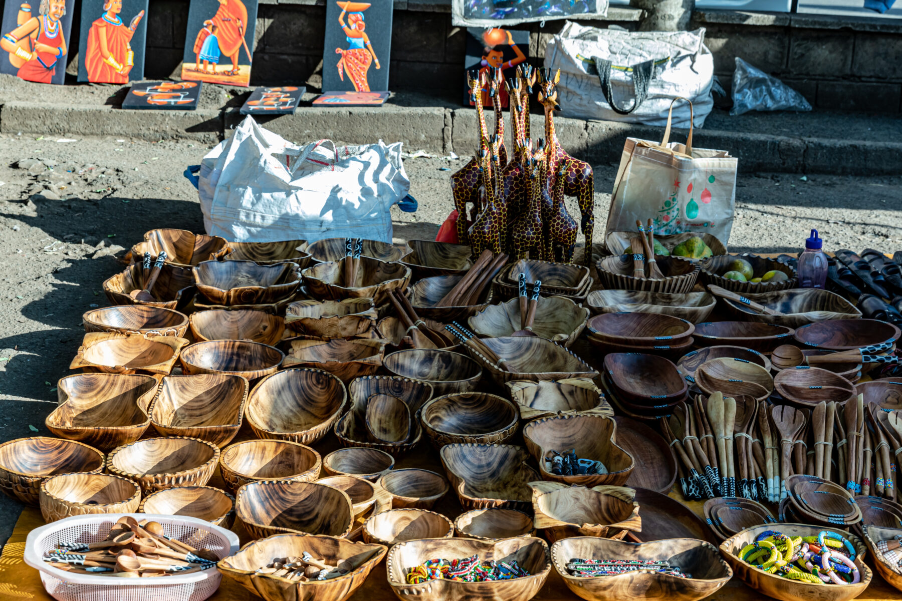 Carved bowls and curios on a trader stall in Nairobi, Kenya