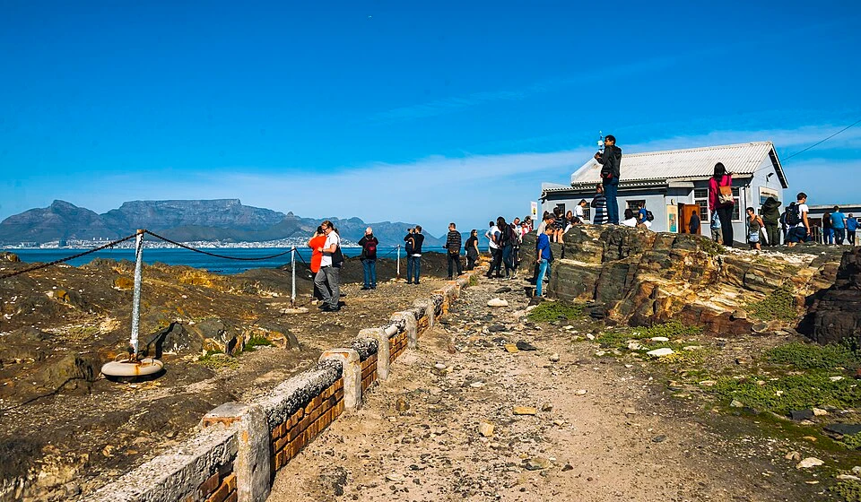 Tourists_looking_at_Table_Mountain_and_Cape_Town_from_viewpoint_on_Robben_Island