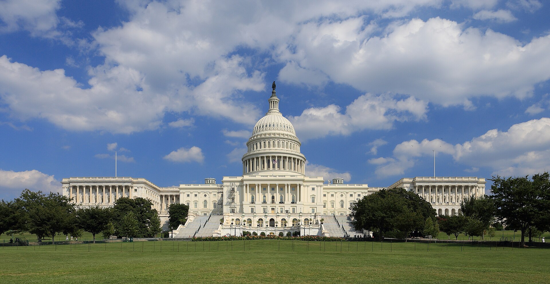 The west front of the United States Capitol in Washington under a blue sky