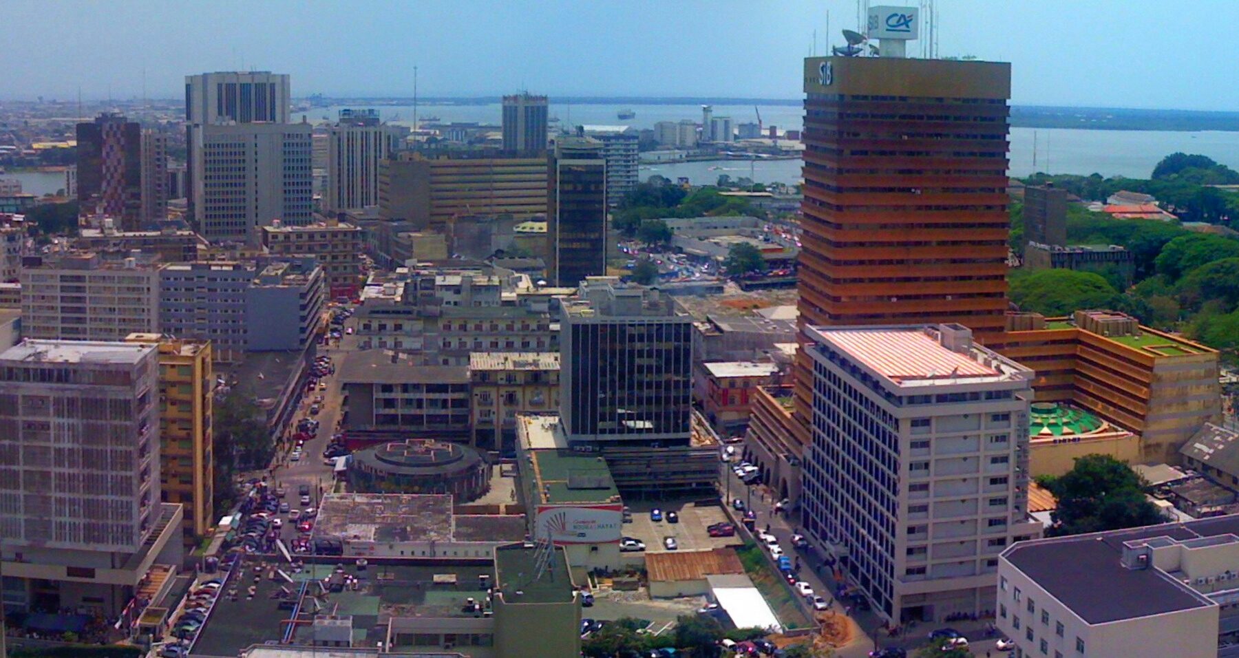 Panorama of Le Plateau, the business district of Abidjan, with office towers and the Ebrie lagoon