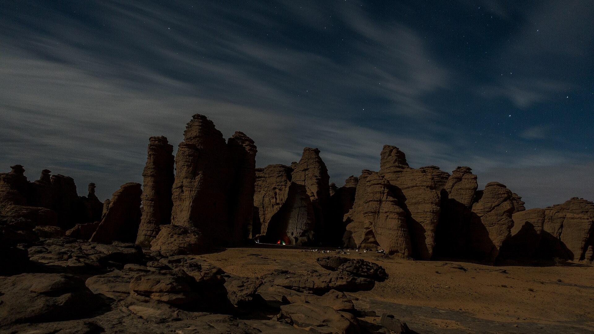 Algeria explained 2026 — sandstone towers on the Tamghit plateau in Tassili n’Ajjer at night