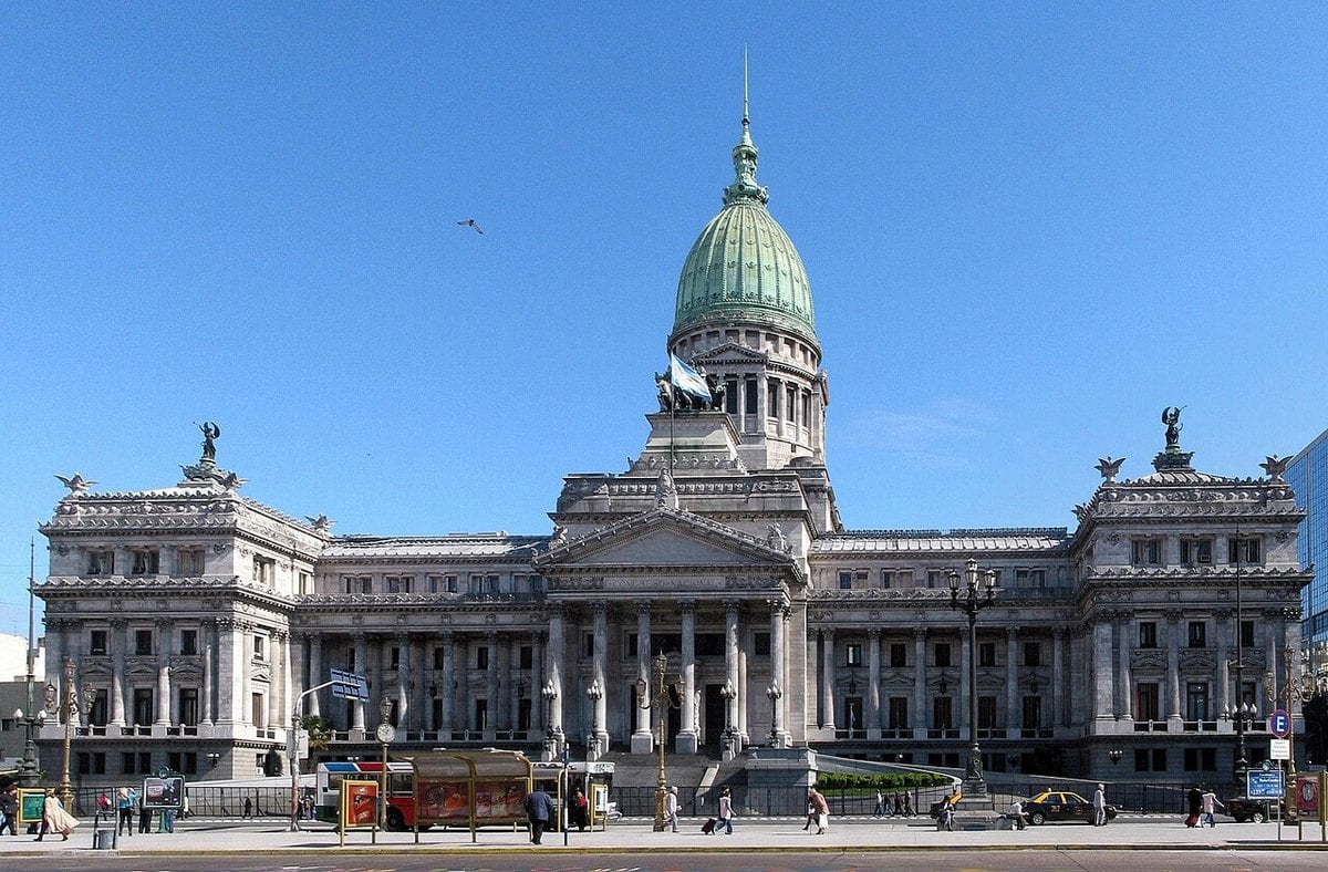 The Argentine National Congress building in Buenos Aires seen from the avenue, with the national flag on the facade