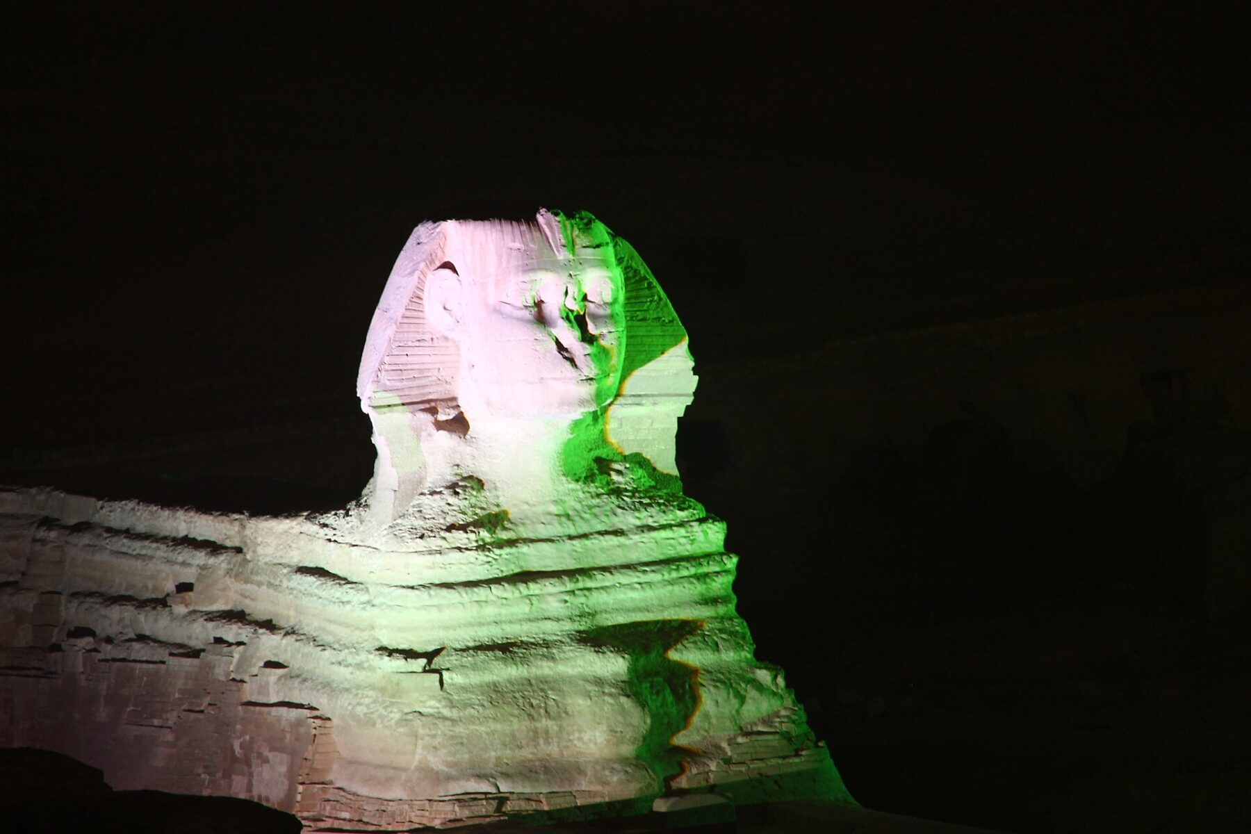 The Great Sphinx lit at night on the Giza plateau in Egypt, where Argy plays the Pyramids of Giza on 6 November 2026