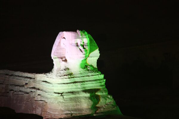 The Great Sphinx lit at night on the Giza plateau in Egypt, where Argy plays the Pyramids of Giza on 6 November 2026
