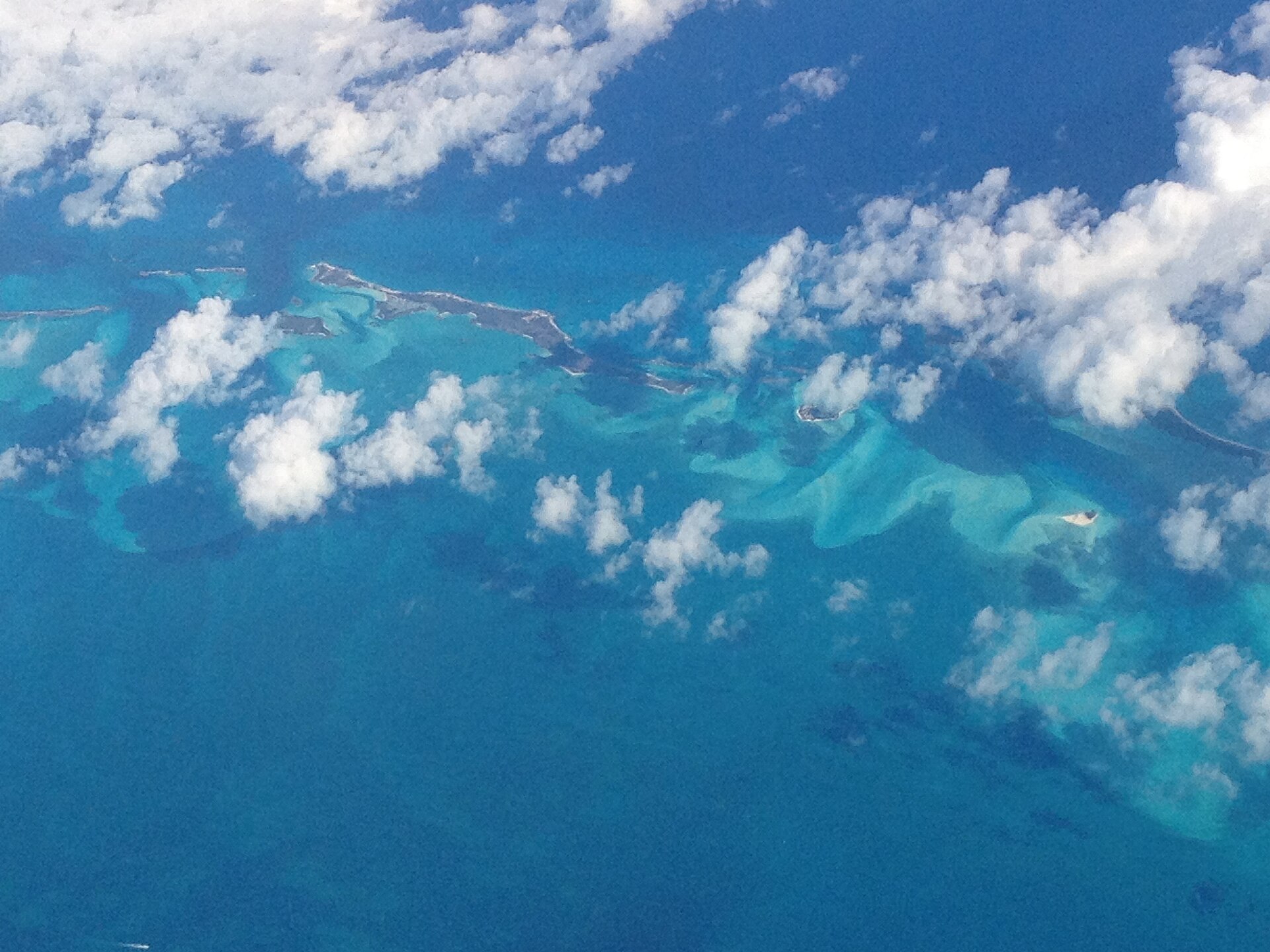 Bahamas explained 2026 — the Exuma cays and shallow banks seen from the air