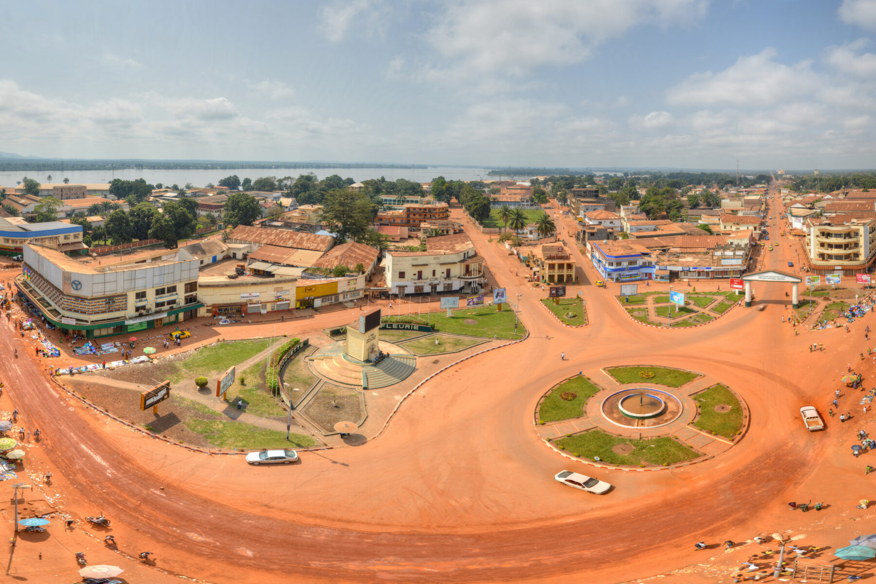 Aerial view of a city with red dirt roads