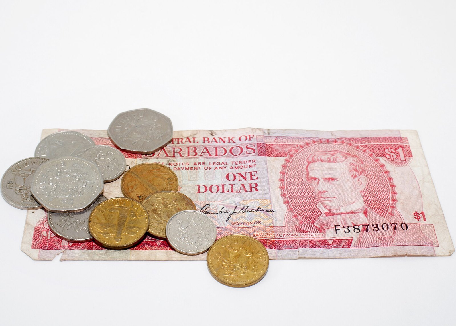 Barbados dollar coins and a one-dollar note from the Central Bank of Barbados