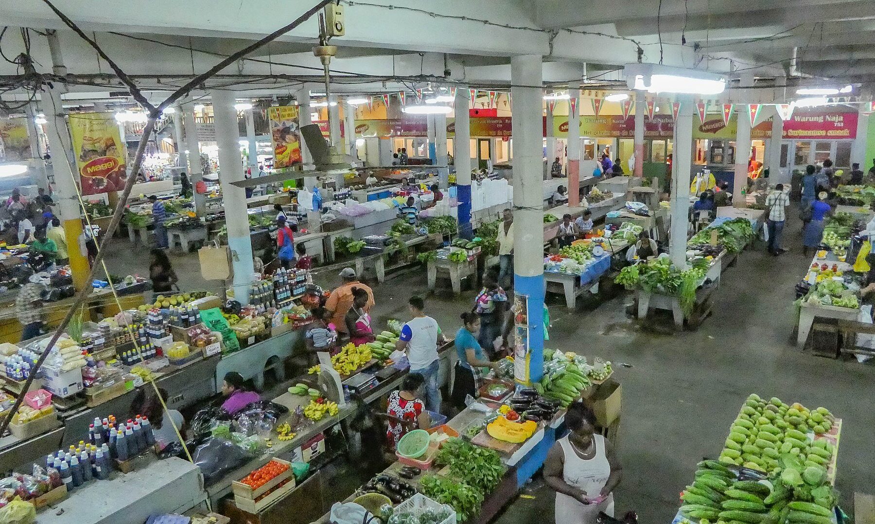 Market hall in Paramaribo, where much of daily trade is still paid in Surinamese dollar cash