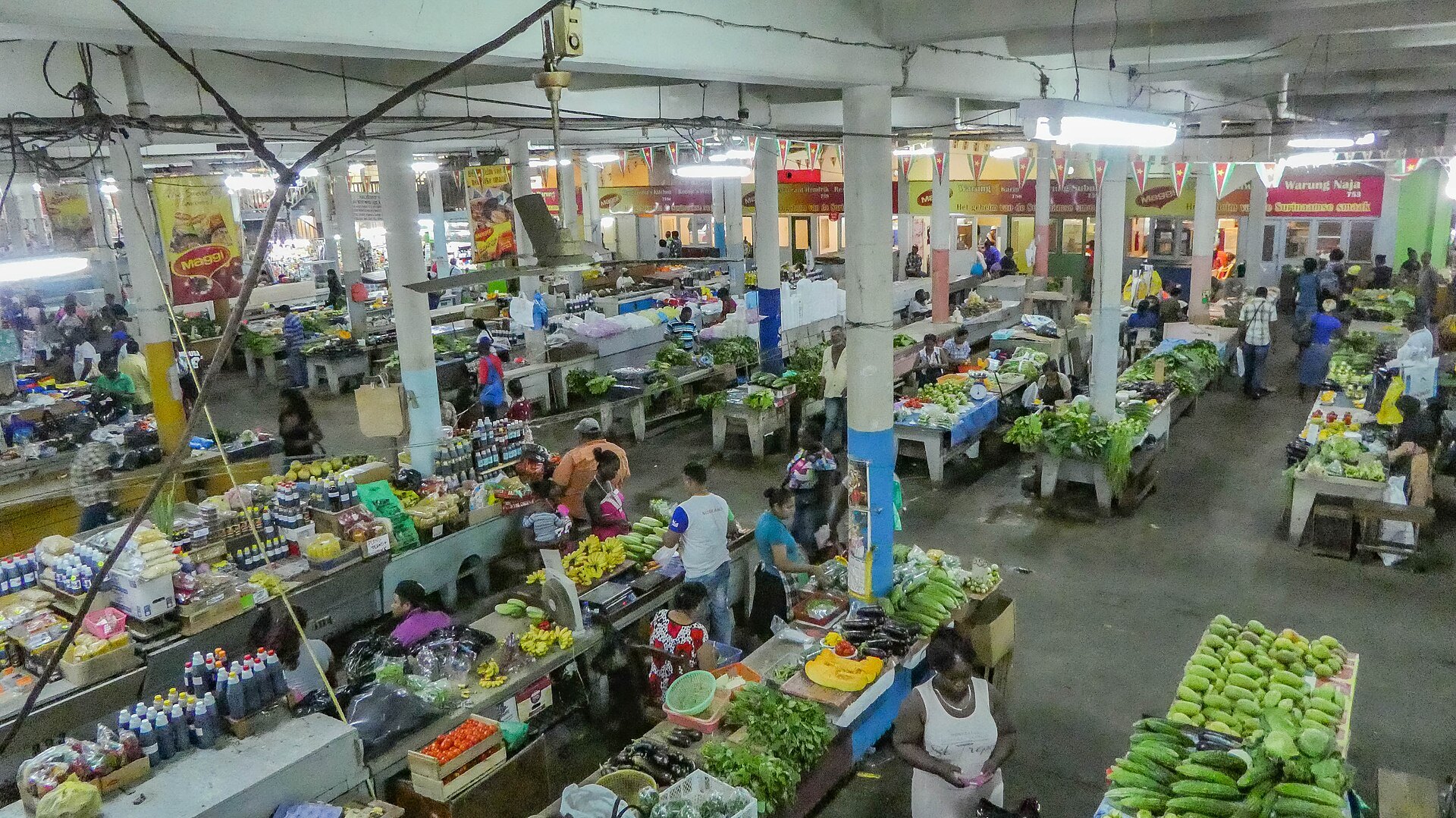 Market hall in Paramaribo, where much of daily trade is still paid in Surinamese dollar cash