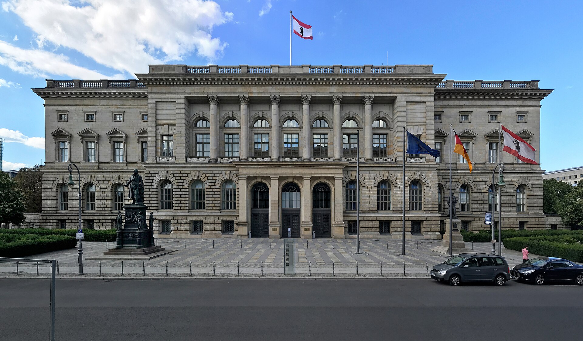 The Abgeordnetenhaus, Berlin's state parliament, a stone building with flags in front
