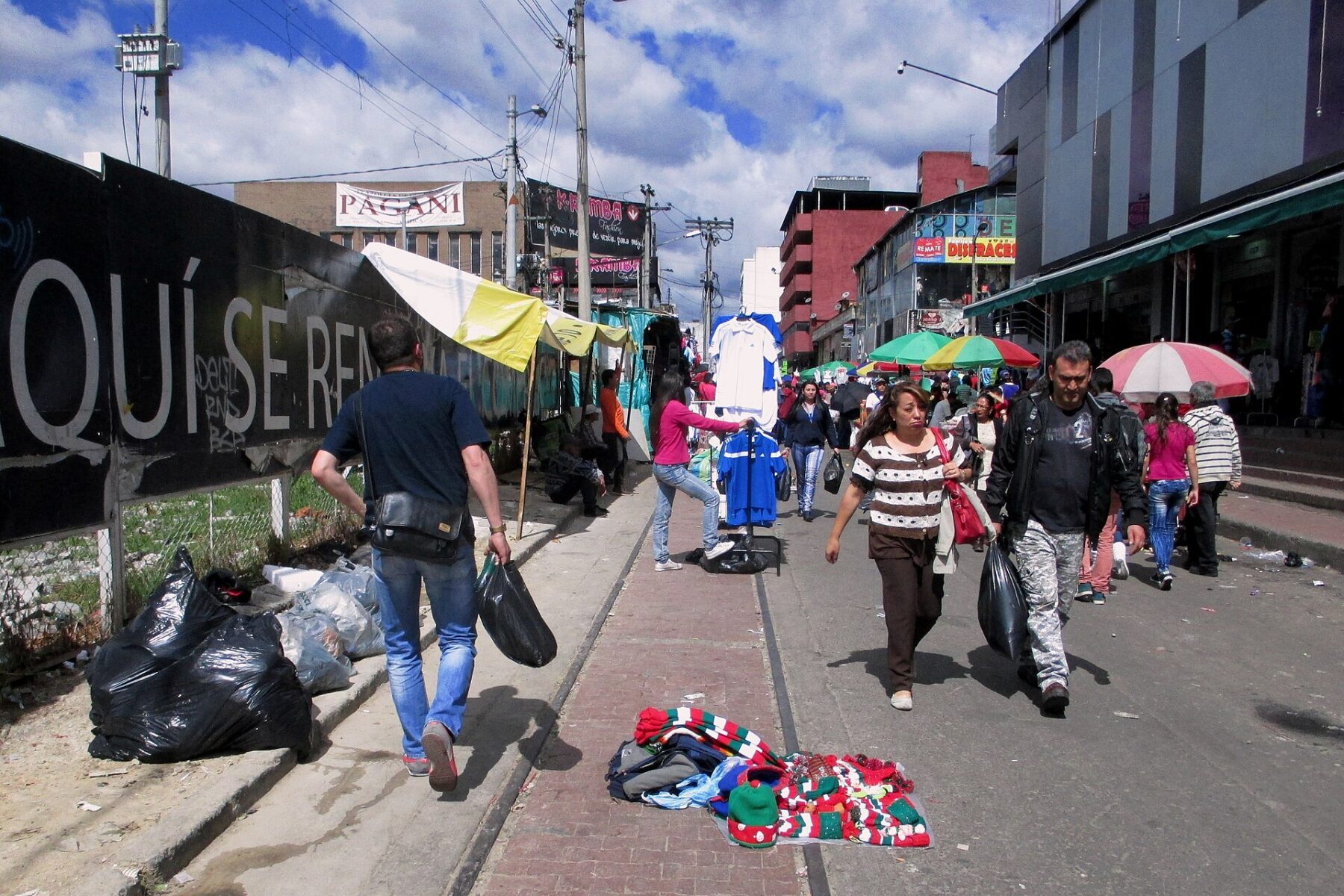 Street vendors and pedestrians in Bogotas San Victorino district, the heart of the capitals informal commerce