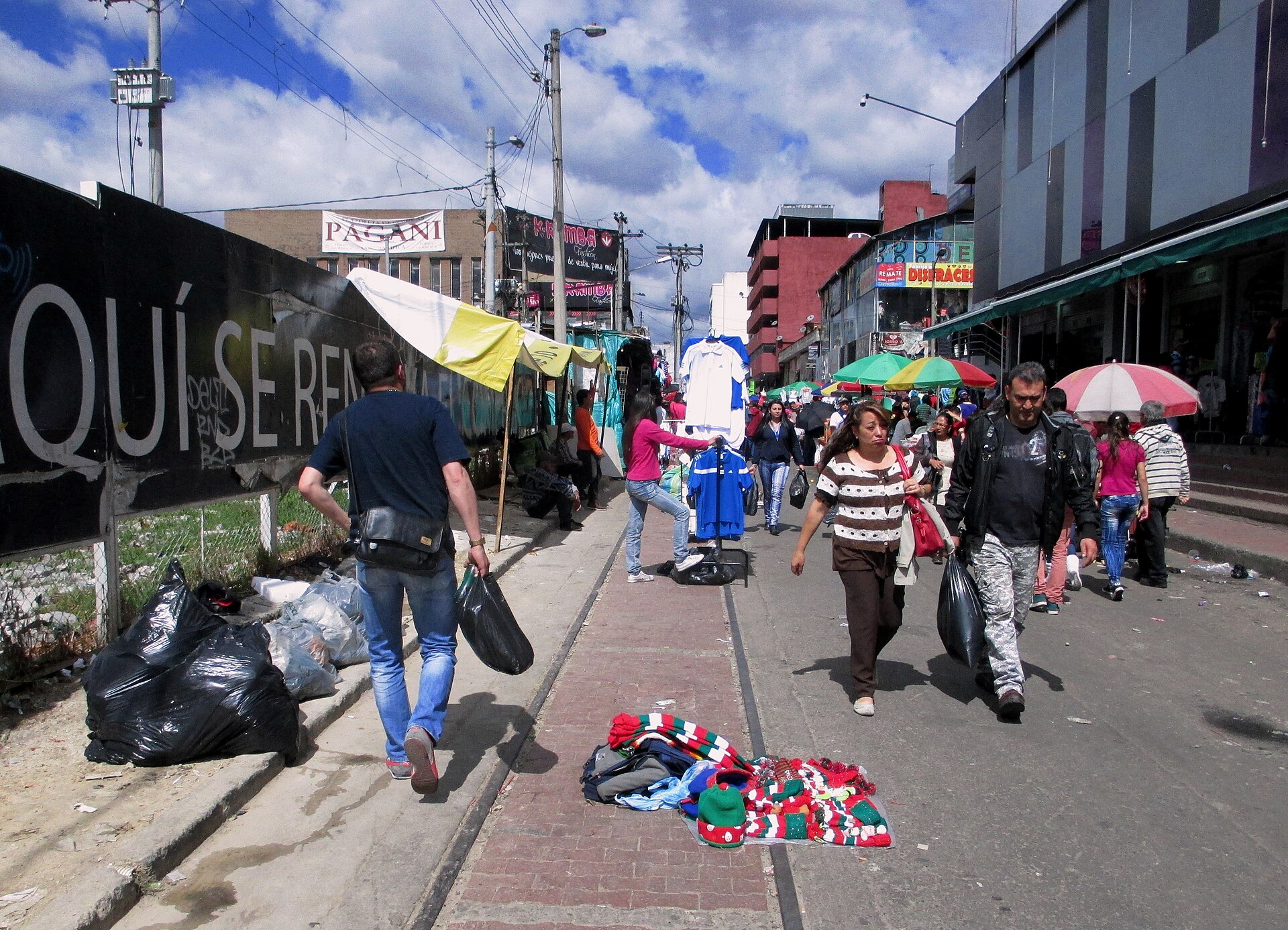 Street vendors and pedestrians in Bogotas San Victorino district, the heart of the capitals informal commerce