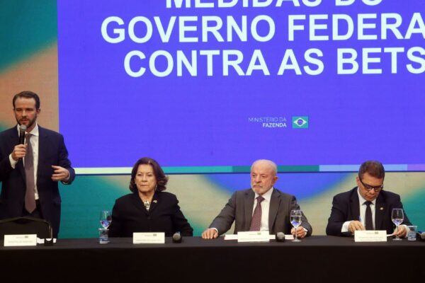 Brazil football clubs betting ban: Finance Minister Dario Durigan speaks beside President Lula under a screen reading Medidas do Governo Federal contra as Bets in São Paulo