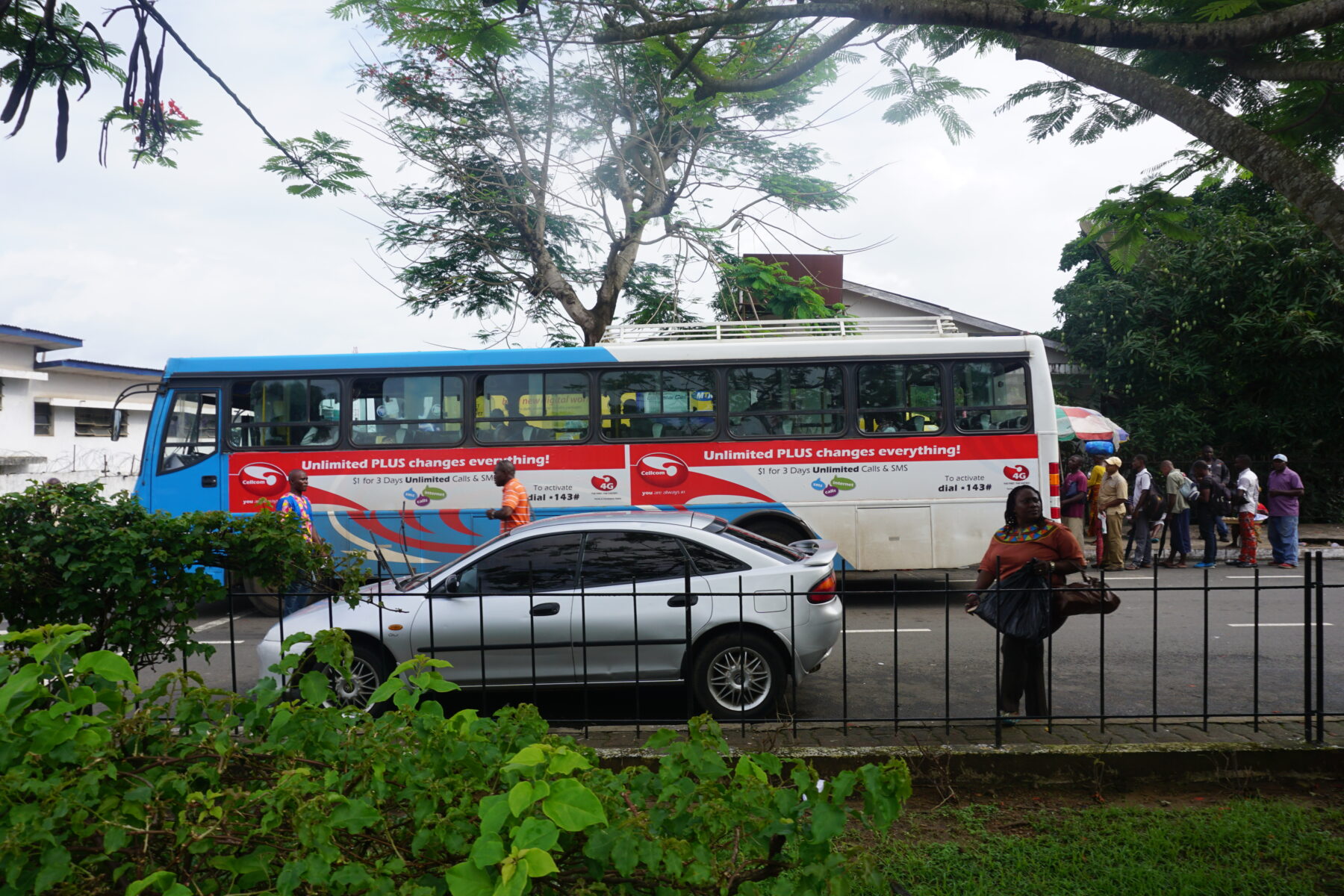 A National Transit Authority bus on Broad Street, Monrovia (Jefferson Krua, CC BY-SA 4.0, via Wikimedia Commons)