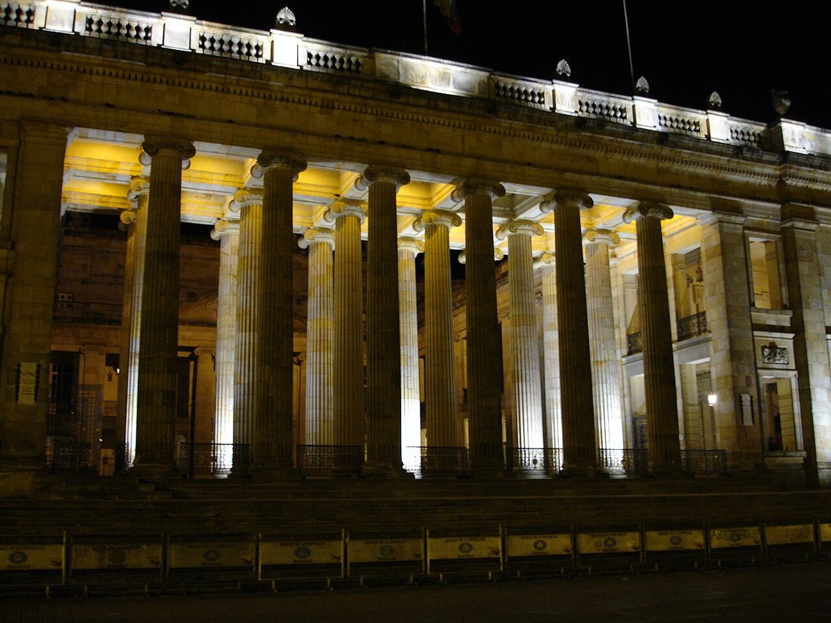 The floodlit columns of Colombia's Capitolio Nacional in Bogotá at night