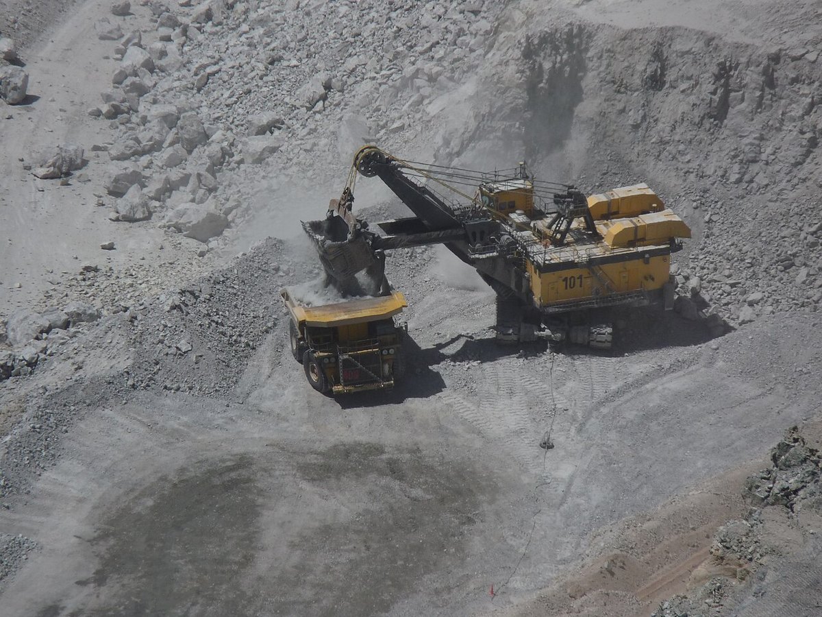 A mining shovel loading ore into a haul truck at the bottom of the Chuquicamata open pit in northern Chile