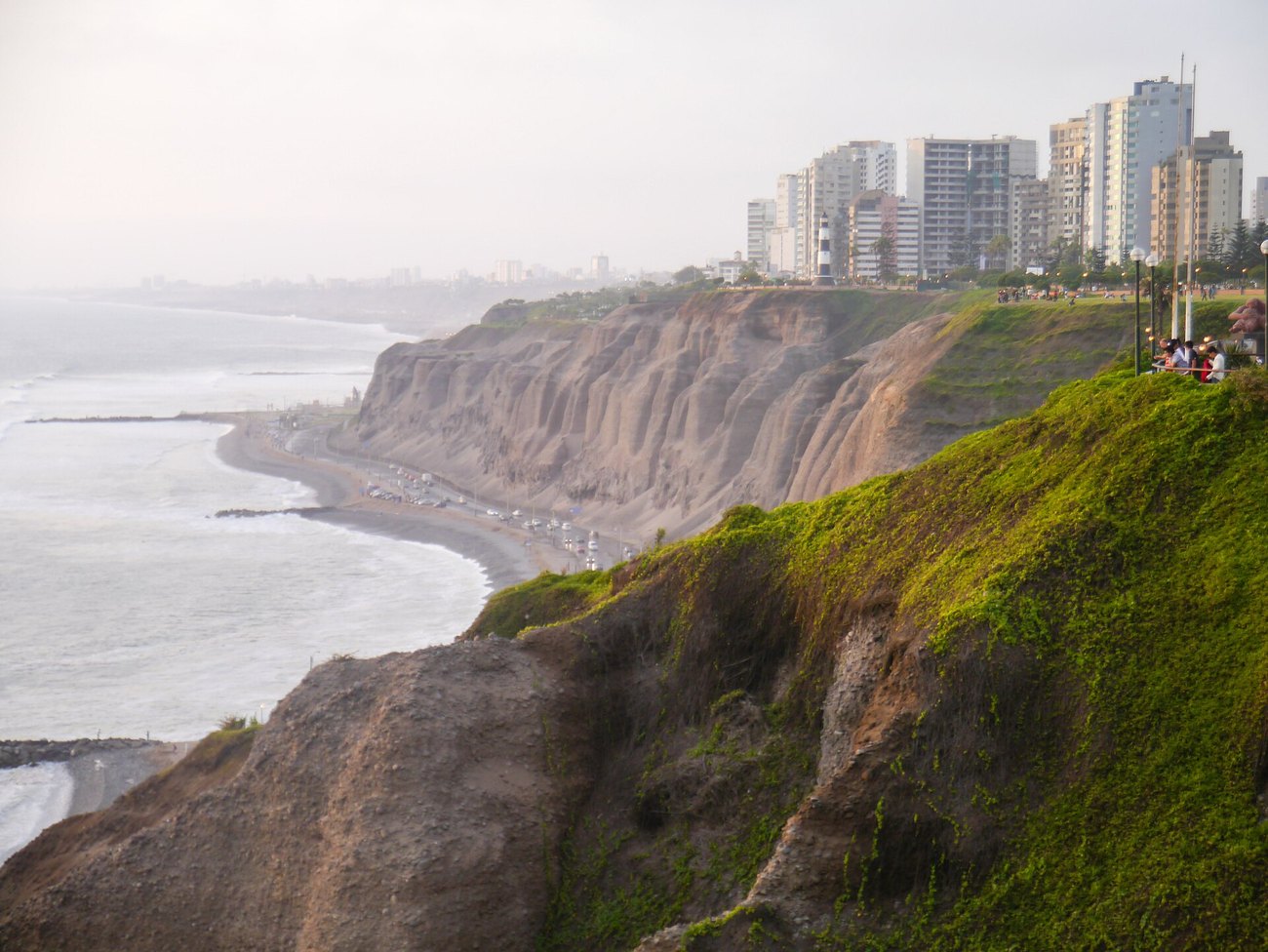 The cliffs of the Costa Verde in Lima, Peru, with apartment towers along the clifftop and the Pacific below.
