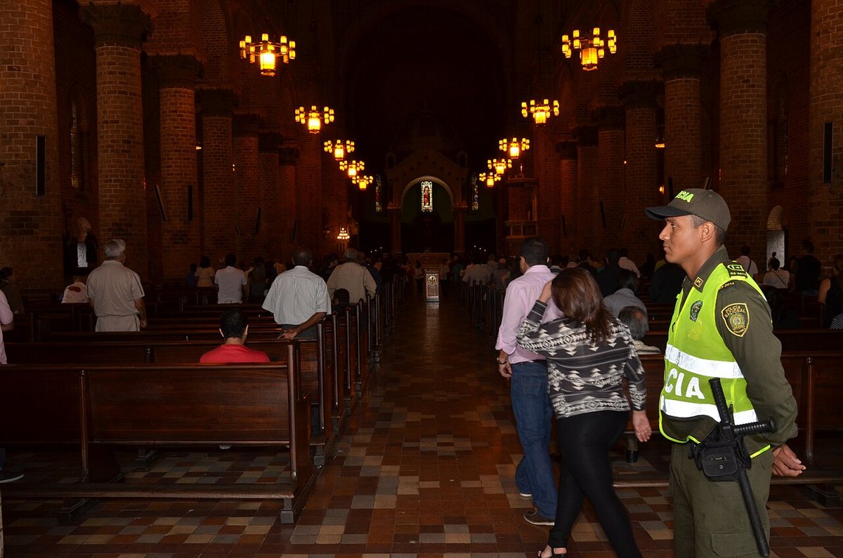 A Colombian National Police officer inside a church in Medellín