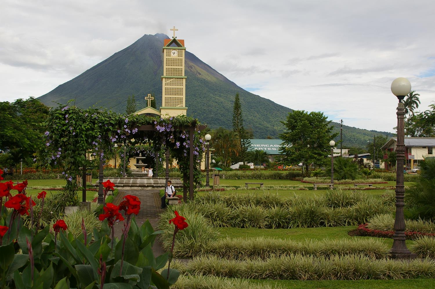 Costa Rica ecotourism — Arenal Volcano seen from the central park of La Fortuna