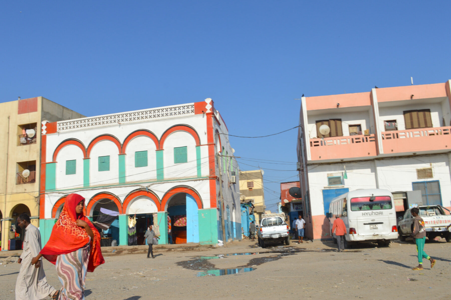 Street scene with colorful buildings and people in Djibouti