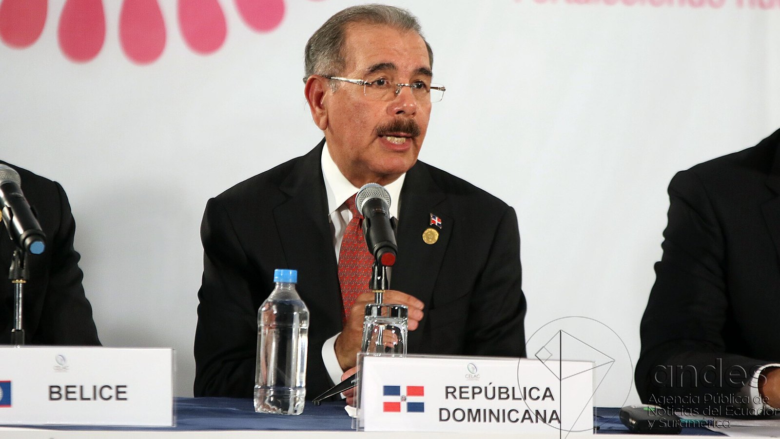 Dominican opposition party: Danilo Medina, PLD president and former Dominican president, speaks at a press conference behind a República Dominicana name card