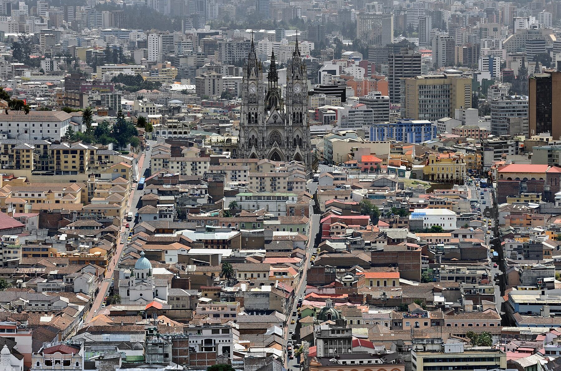 Ecuador explained 2026 — the historic centre of Quito seen from El Panecillo, with the Basílica del Voto Nacional