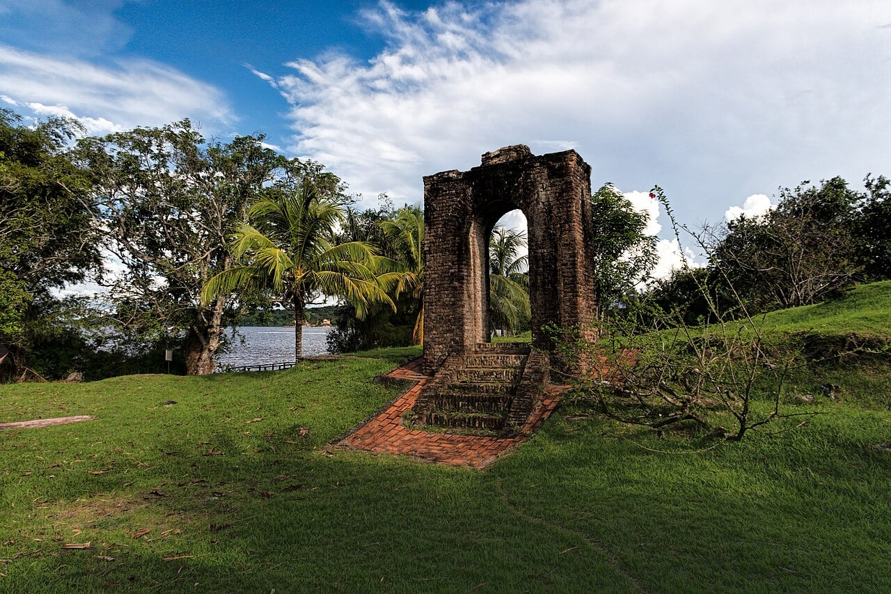 Essequibo region, Guyana: the brick gateway ruin of the Dutch fort of Kyk-Over-Al beside the river, under palm trees