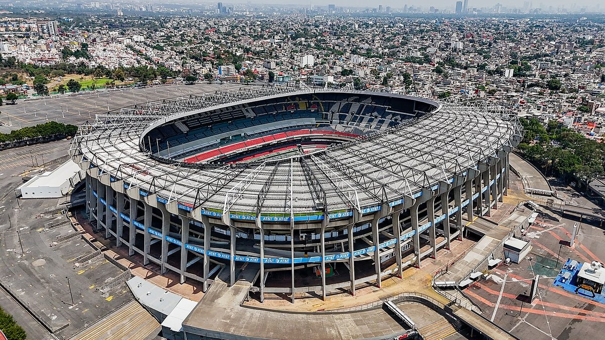 Aerial view of the Estadio Azteca in Mexico City, with the surrounding esplanade and car parks visible