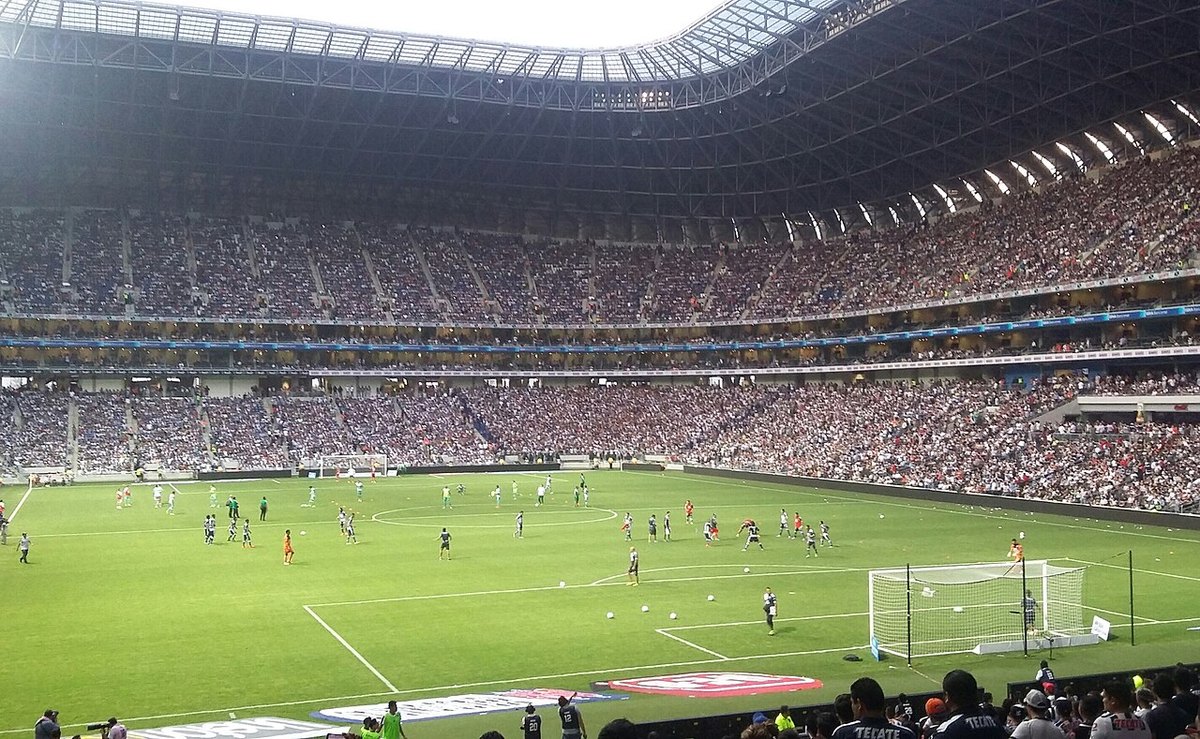 A packed Estadio BBVA in Guadalupe during a football match, seen from the upper stand