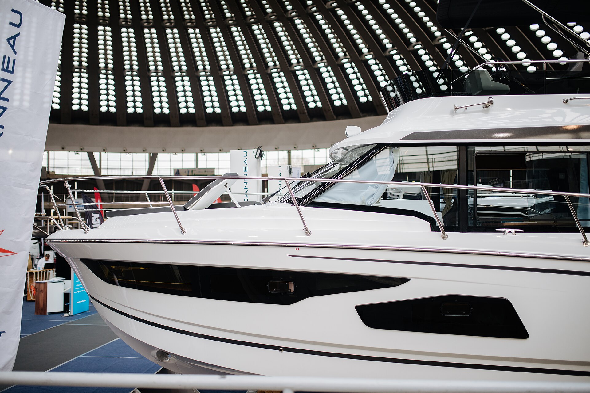 A motor yacht on display at an indoor boat exhibition — the São Paulo Boat Show 2026 runs September 24–29 in Brazil