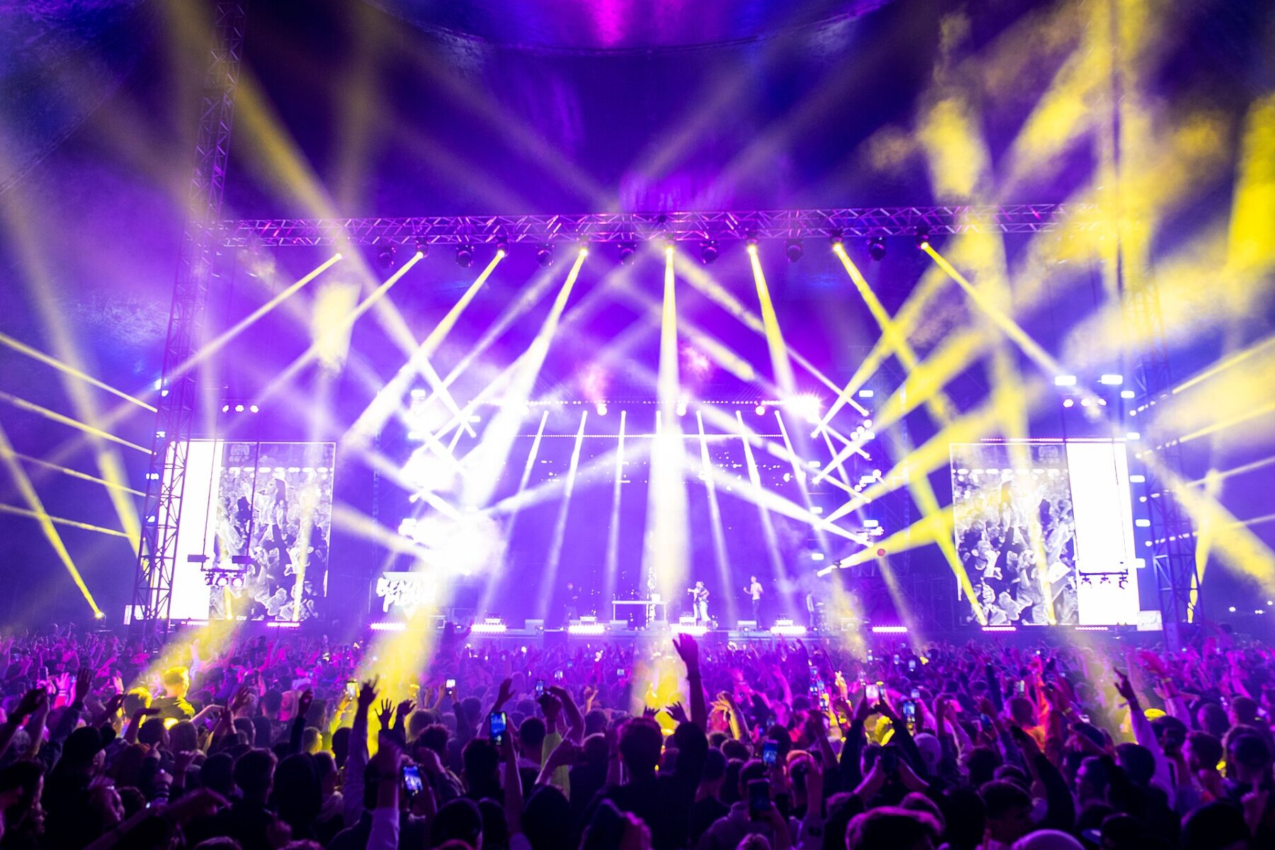 A festival crowd under stage lights at night — Coca-Cola Flow Fest 2026 takes over Mexico City's Autódromo Hermanos Rodríguez on November 28 and 29