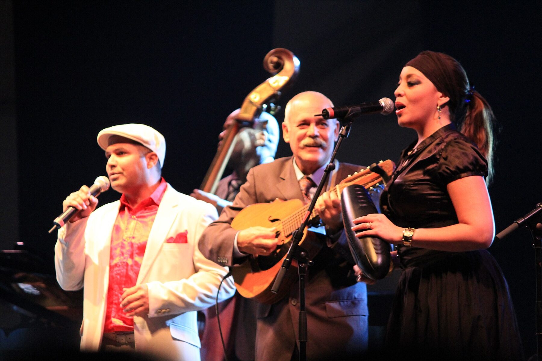Cuban musicians performing on stage, in the tradition La Charanga Habanera brings to Lima