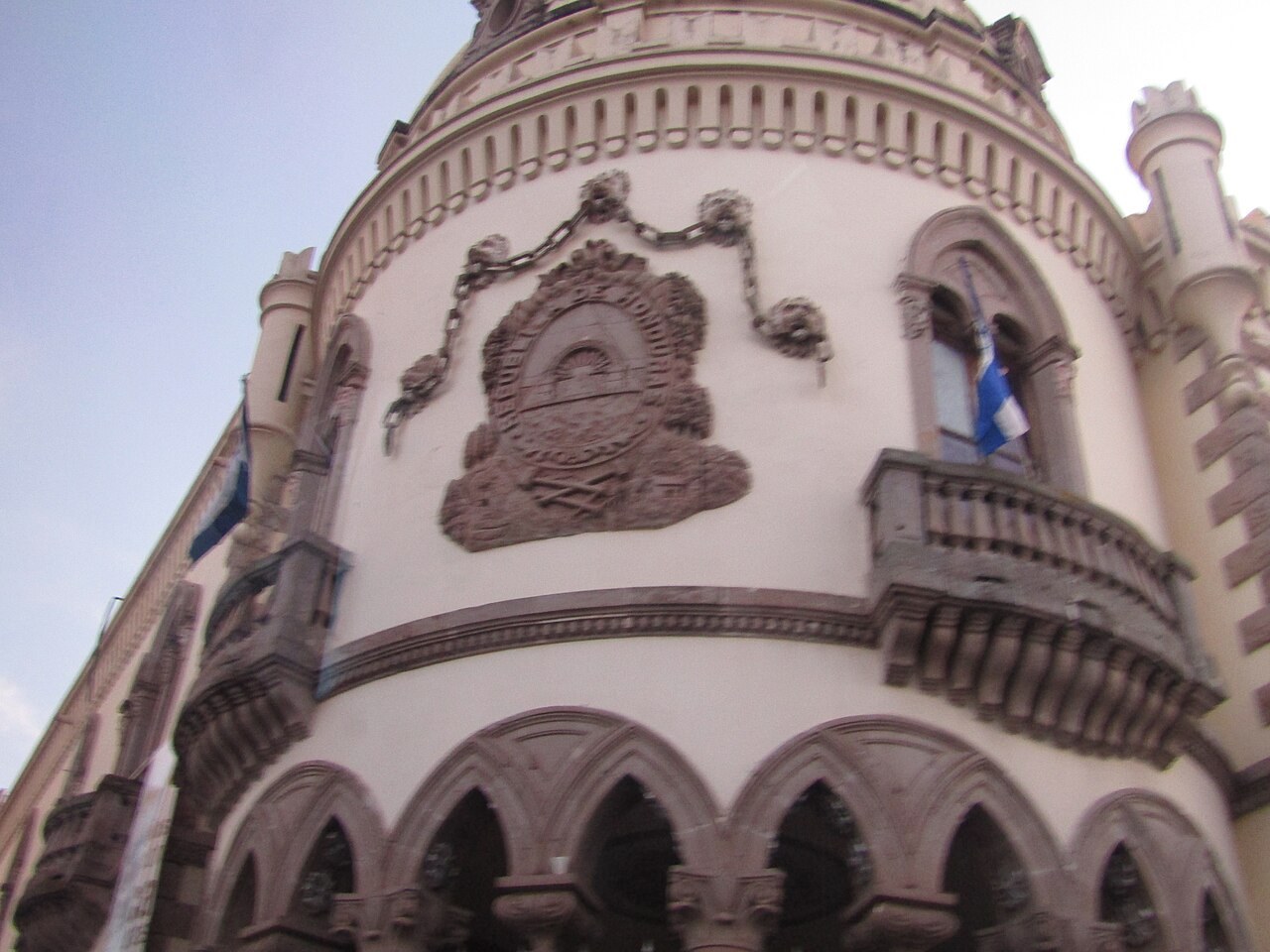 Honduras 2027 budget - Ornate facade of the former presidential palace in Tegucigalpa with the Honduran coat of arms