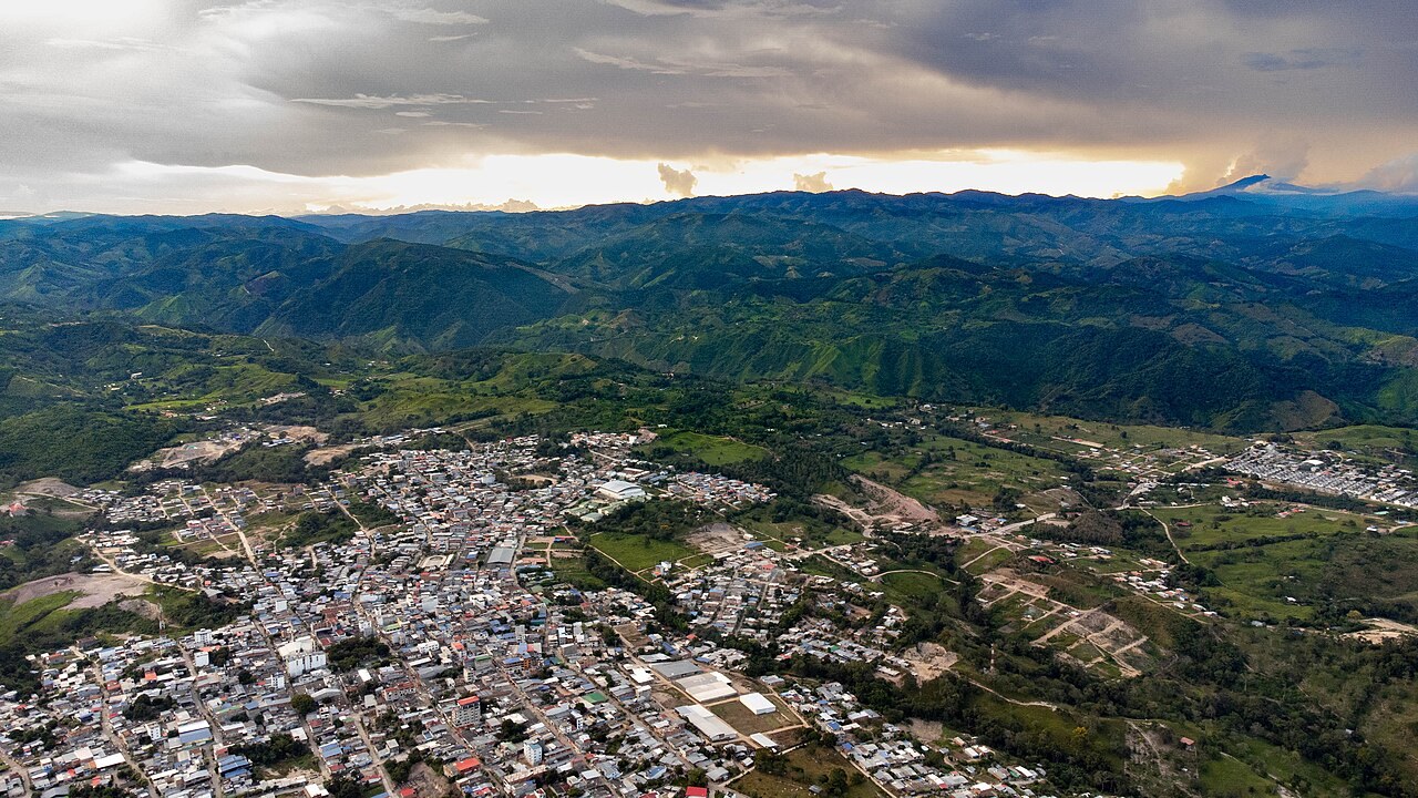 Colombia illegal gold mining - Aerial panorama of the town of Santa Rosa del Sur surrounded by green hills