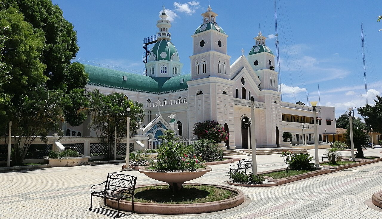 San Juan farmers protest - The white cathedral of San Juan Bautista with green domes, seen from the town square
