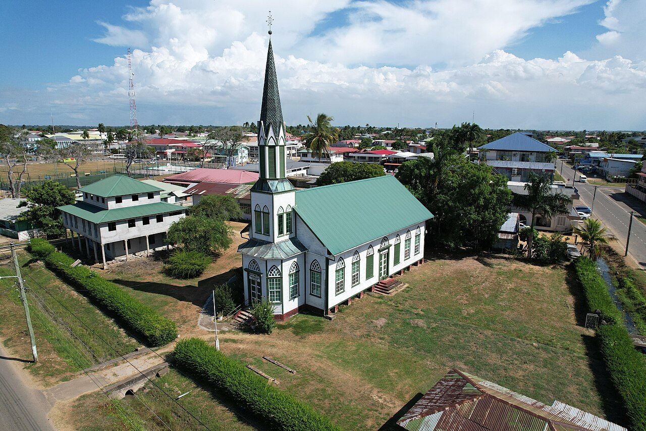 missing Surinamese men - Aerial view of a wooden church and parsonage in Nieuw Nickerie, Suriname